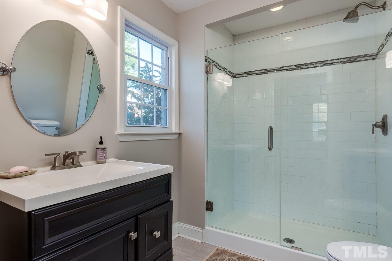 2411 Boswell Road Raleigh, NC 27610 - Photo 17 of 26 a bathroom with a sink and a mirror