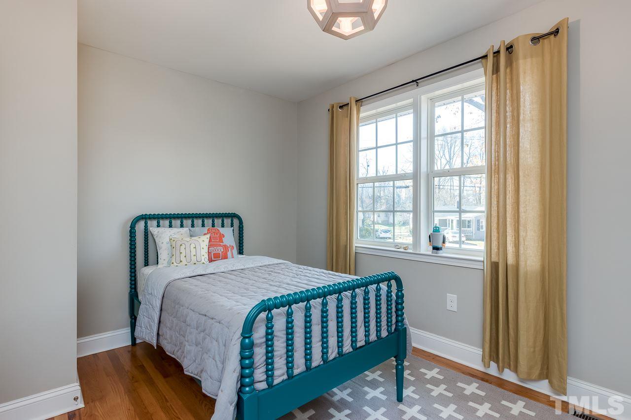 2411 Boswell Road Raleigh, NC 27610 - Photo 19 of 26 a bedroom with a bed and a window