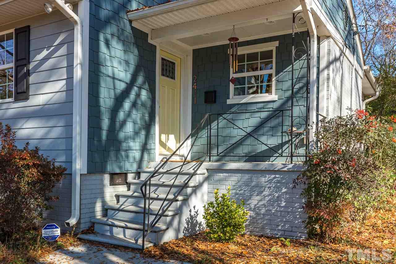 2411 Boswell Road Raleigh, NC 27610 - Photo 3 of 26 a front view of a house with a yard