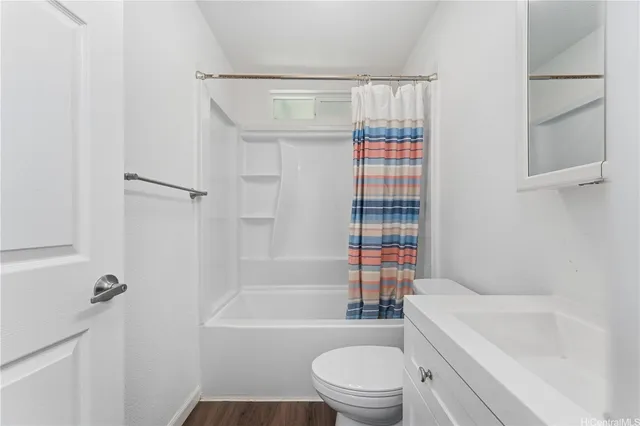 a bathroom with a toilet and a bathtub