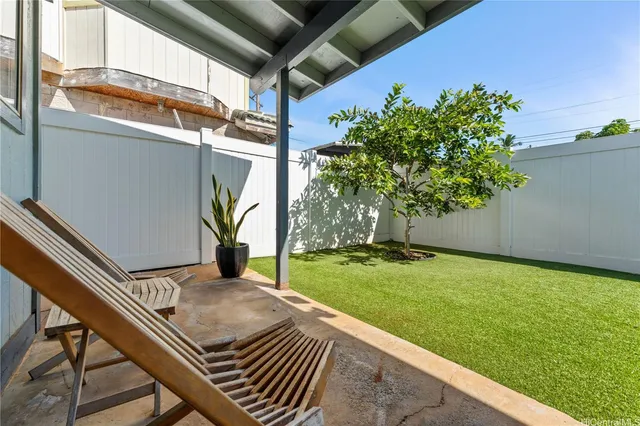 a backyard of a house with lots of green space