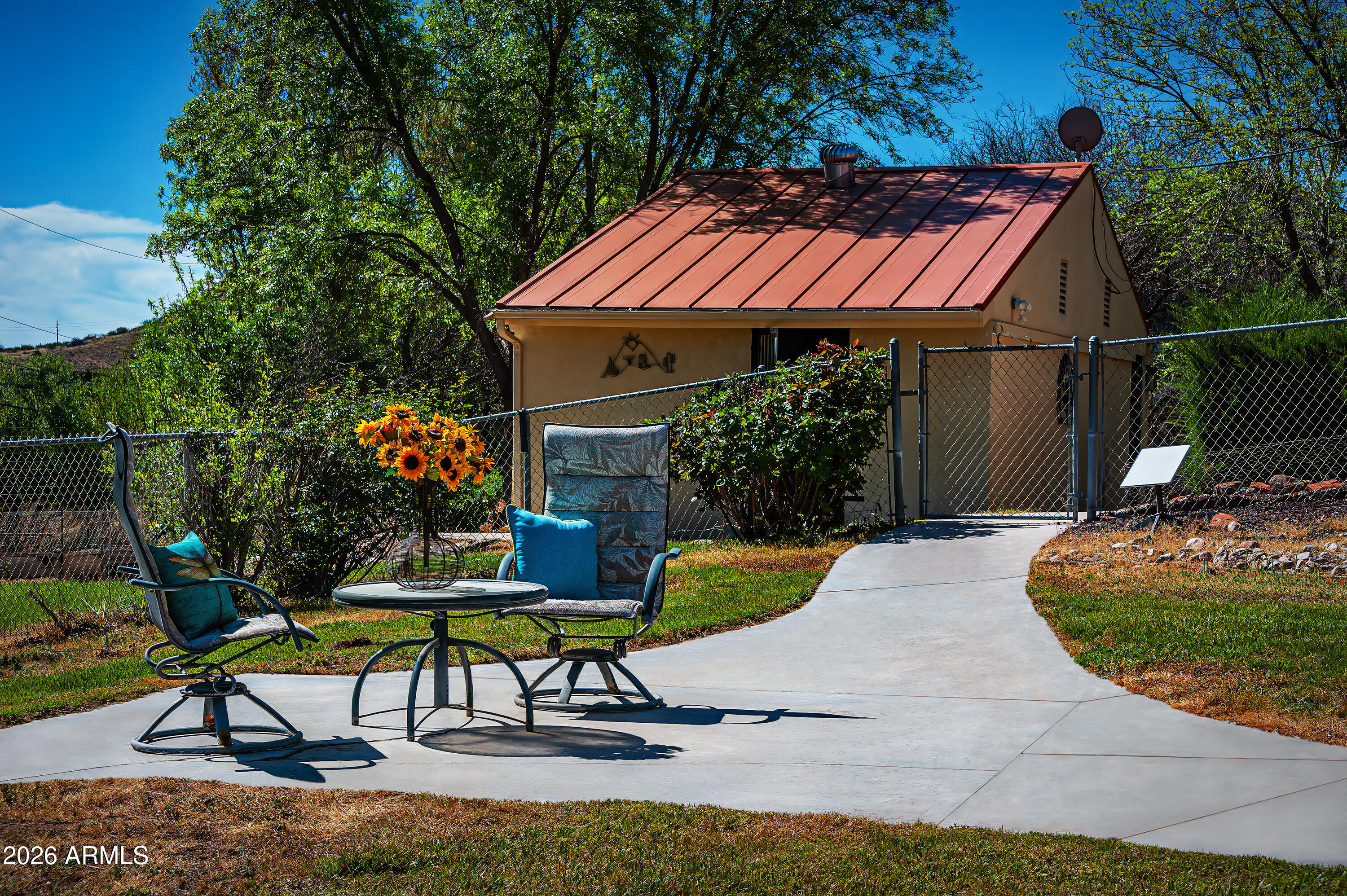 1945 South Loy Road Cornville, AZ 86325 - Photo 22 of 47 a patio with a table and chairs under an umbrella