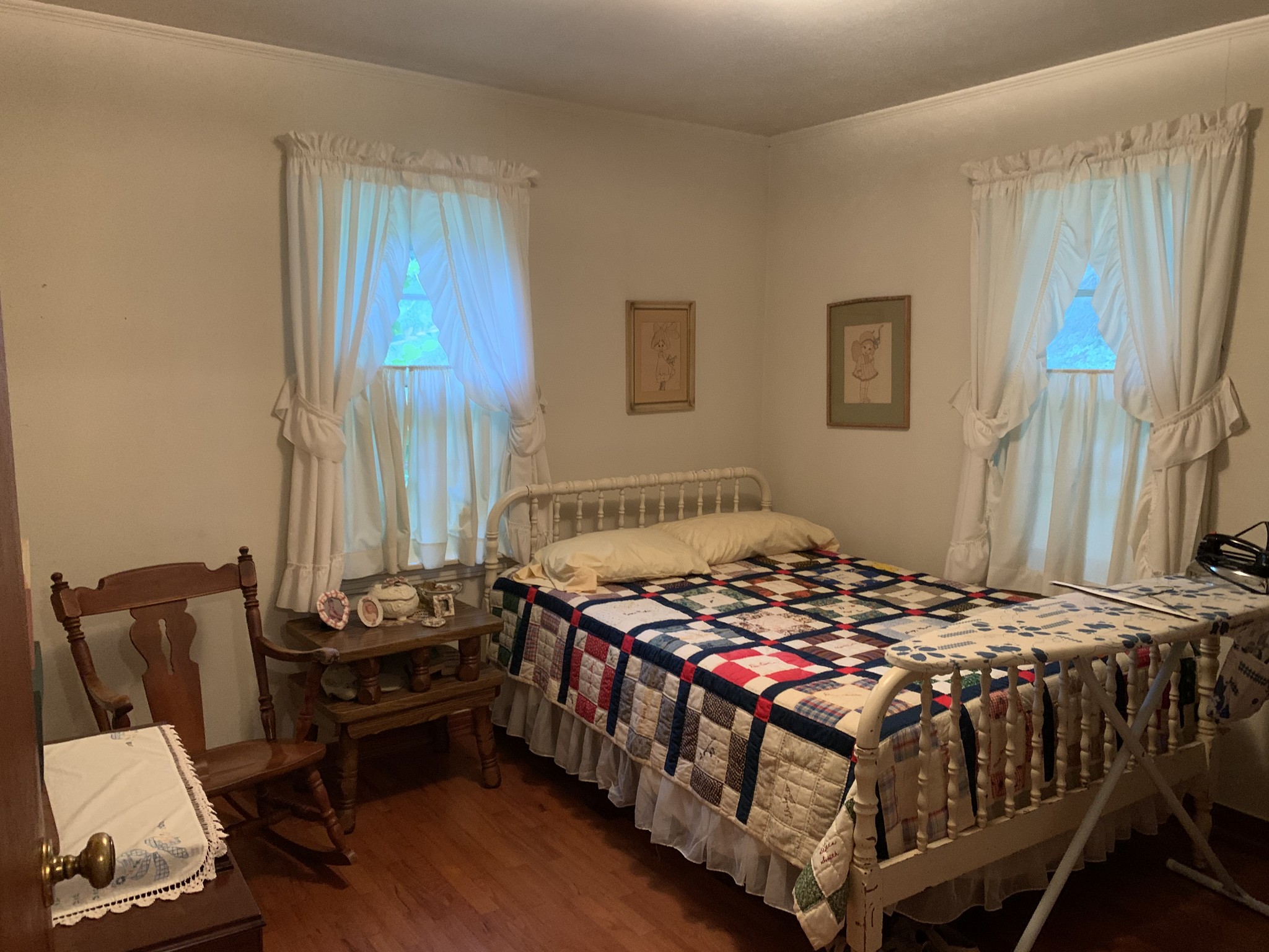 1585 Laster School Road Huron, TN 38345 - Photo 11 of 14 a bedroom with a bed and wooden floor