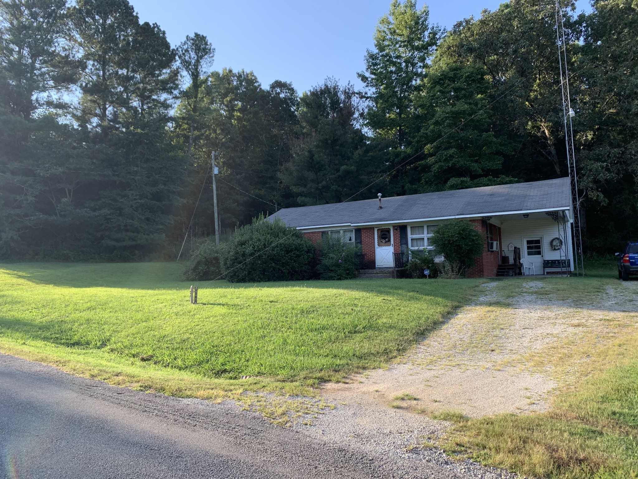 1585 Laster School Road Huron, TN 38345 - Photo 14 of 14 a front view of a house with a yard