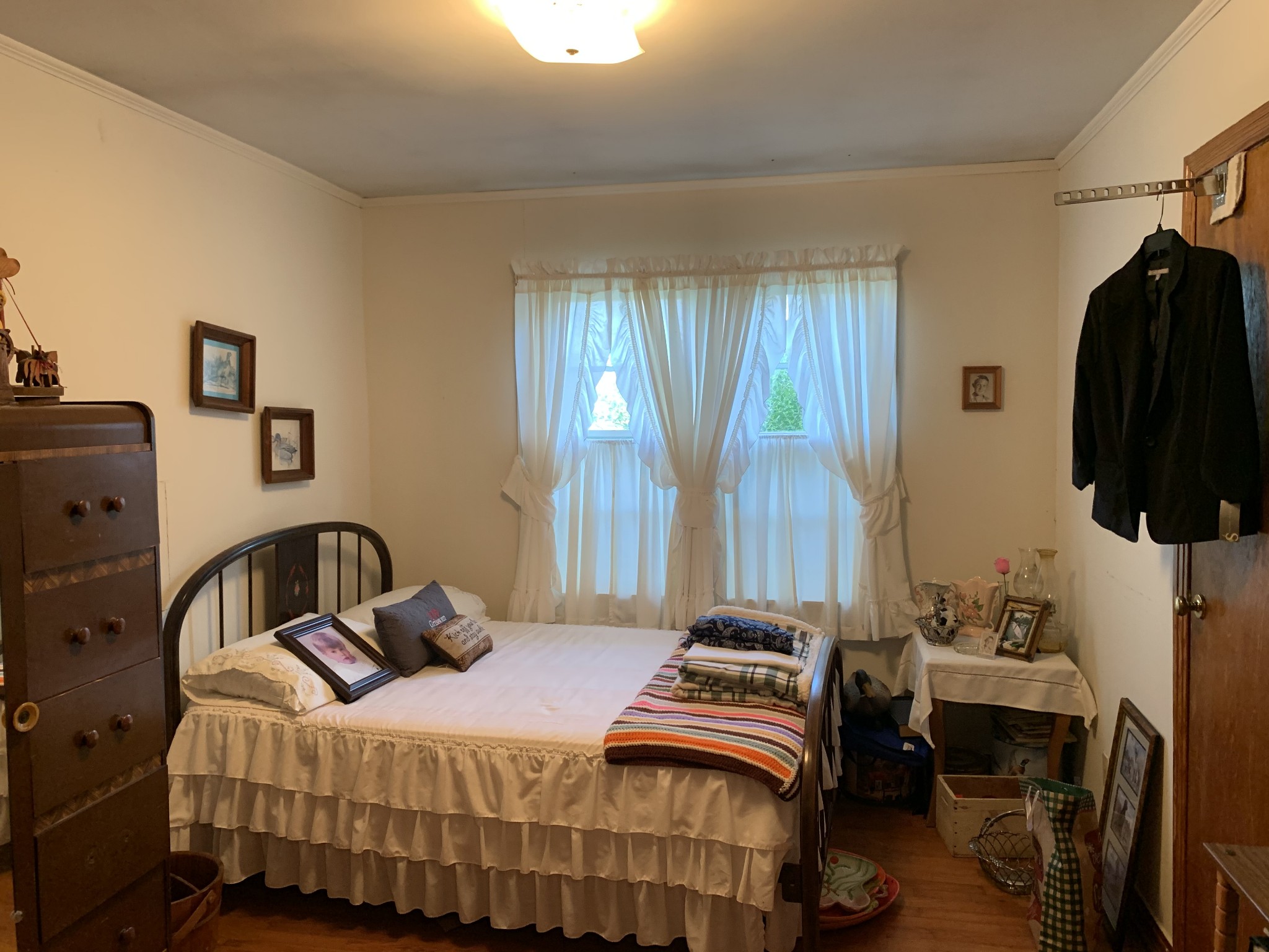 1585 Laster School Road Huron, TN 38345 - Photo 6 of 14 a bedroom with a bed and teddy bear on bed