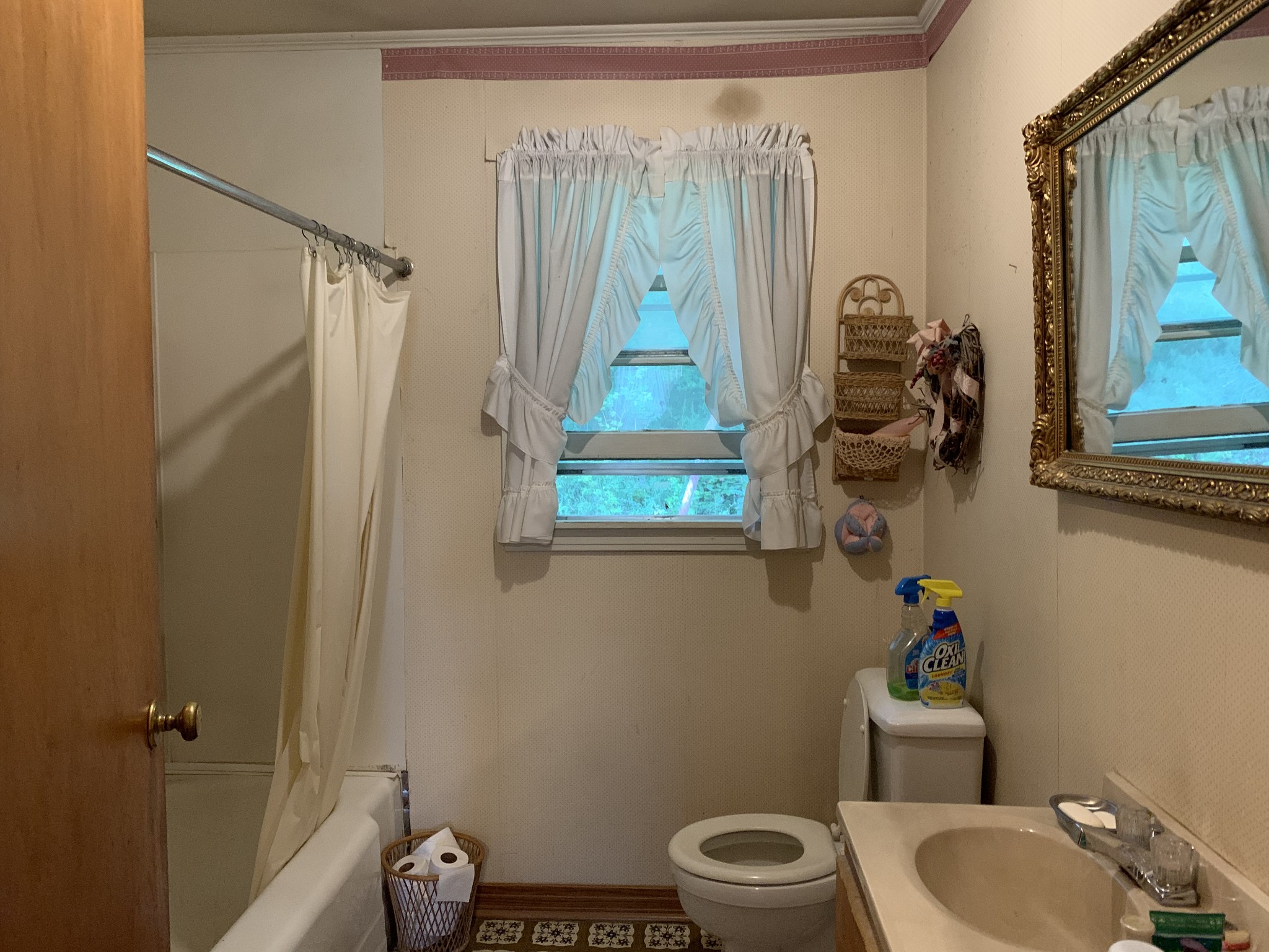 1585 Laster School Road Huron, TN 38345 - Photo 8 of 14 a bathroom with a toilet and a shower curtain