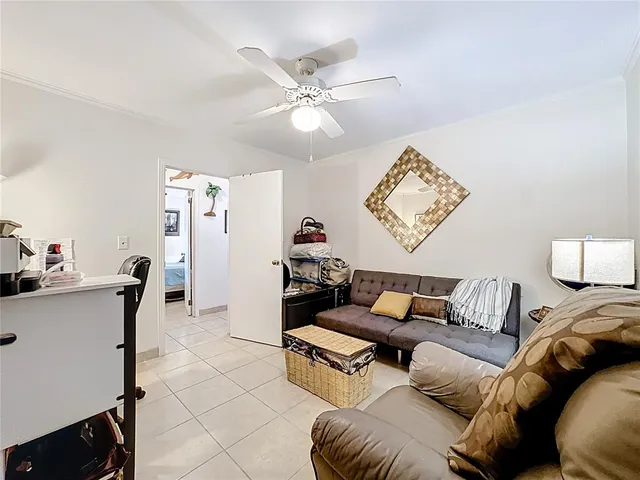 a balcony with furniture and a potted plant