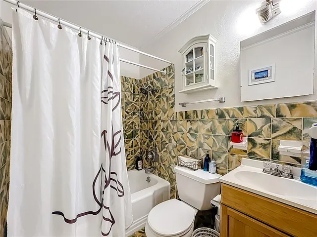 a kitchen with stainless steel appliances a refrigerator sink and cabinets