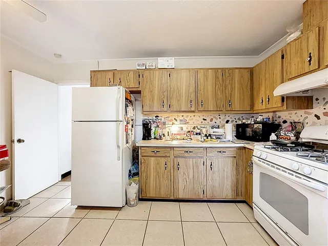 a view of a lake with houses in the back