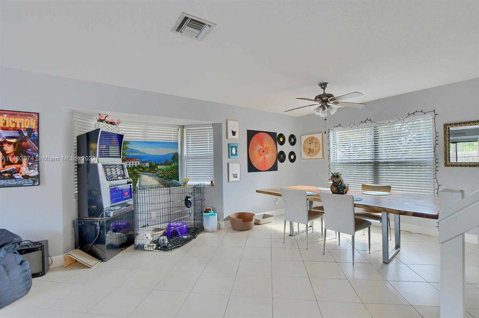 256 Southwest 6th Street, Unit 6 Boca Raton, FL 33432 - Photo 14 of 39 a living room with furniture and a flat screen tv