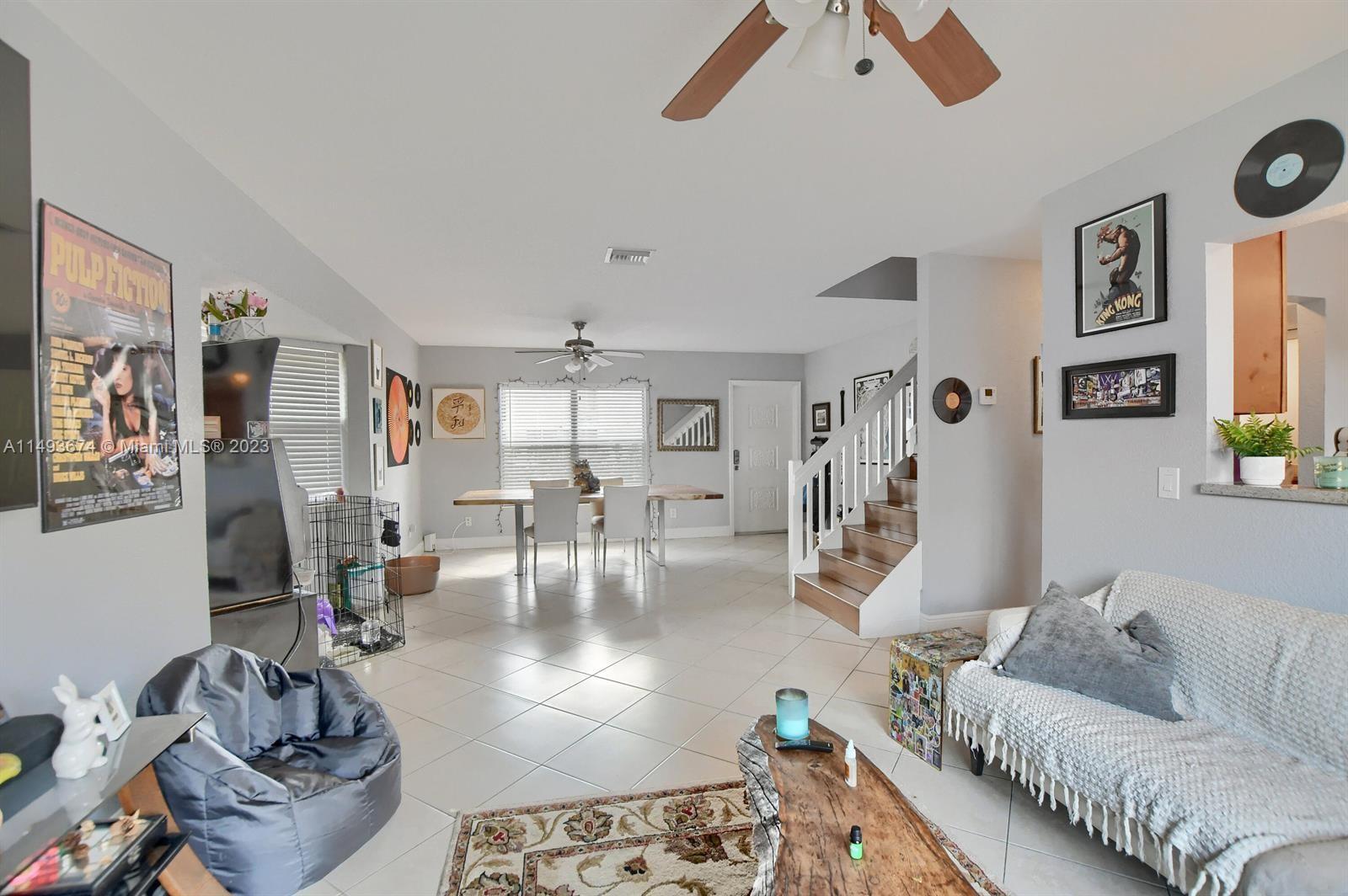 256 Southwest 6th Street, Unit 6 Boca Raton, FL 33432 - Photo 15 of 39 a living room with furniture and wooden floor