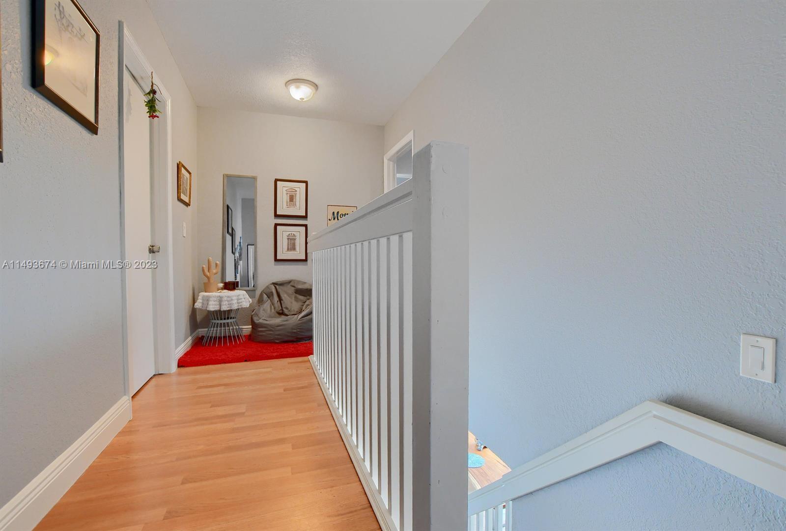 256 Southwest 6th Street, Unit 6 Boca Raton, FL 33432 - Photo 22 of 39 a view of a gallery with red door