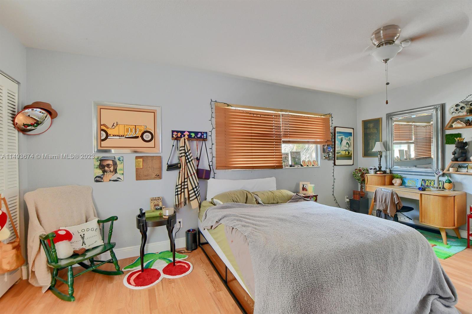 256 Southwest 6th Street, Unit 6 Boca Raton, FL 33432 - Photo 25 of 39 a bedroom with furniture and a bed