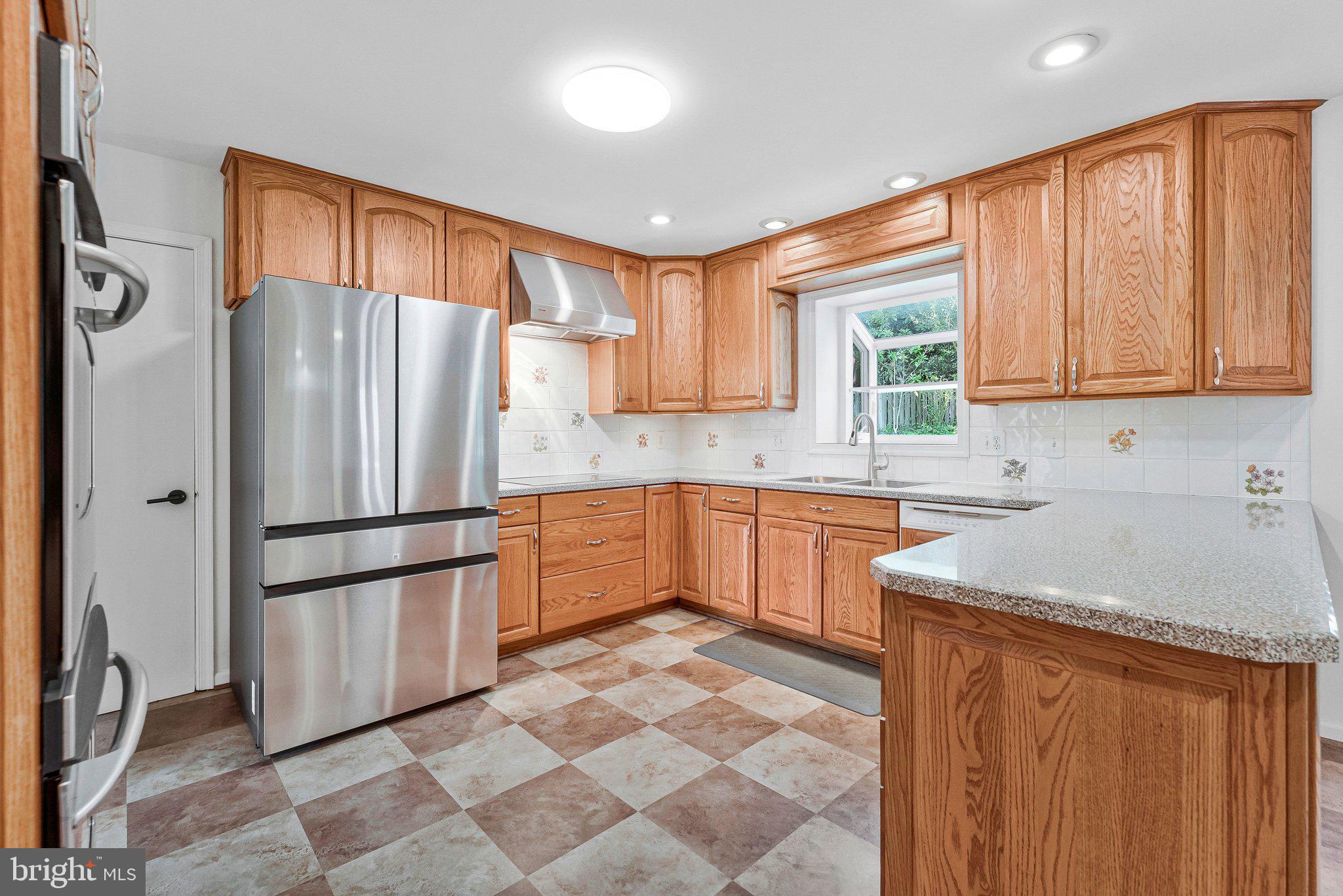 7730 Falstaff Road McLean, VA 22102 - Photo 25 of 83 Large kitchen with stainless steel appliances