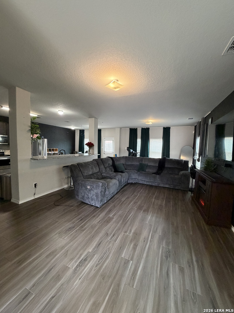 10814 Randolph Way Converse, TX 78109 - Photo 2 of 8 a living room with furniture and a wooden floor