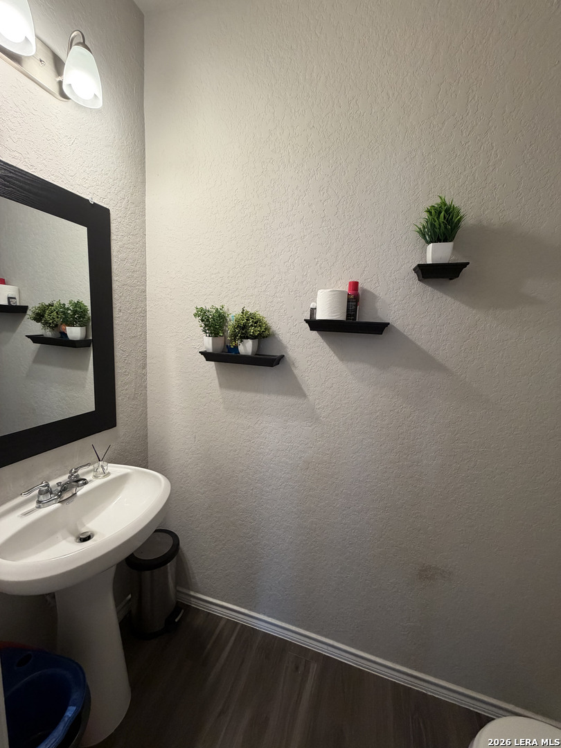 10814 Randolph Way Converse, TX 78109 - Photo 6 of 8 a room with a table and a mirror