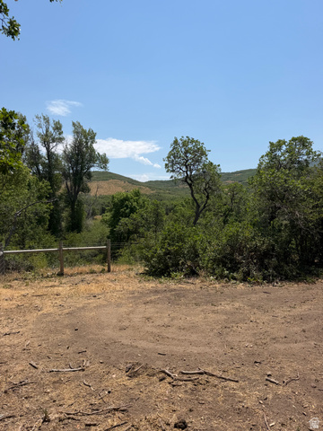 785 Hardscrabble Road Morgan, UT 84050 - Photo 4 of 16 Expansive natural terrain featuring a rustic wooden fence and mature trees