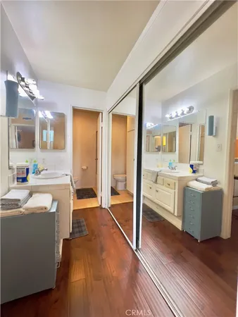 a en suite bathroom with a sink and a mirror