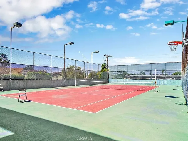 a view of a patio with lawn chairs
