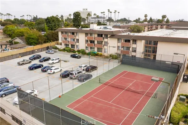 an aerial view of residential houses with swimming pool