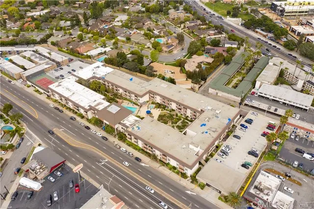 a view of a livingroom with workspace and gym equipment