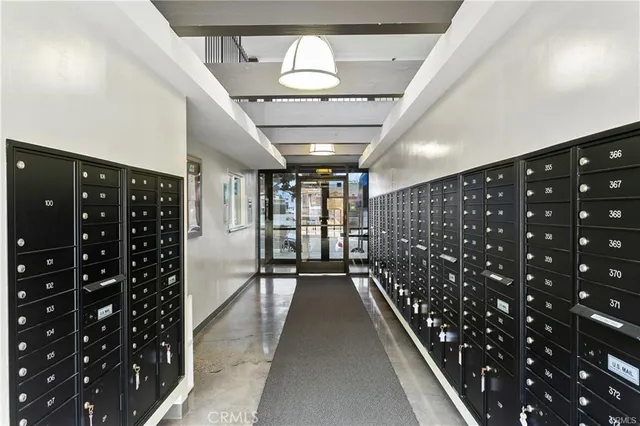 a yellow building with trees in front of it