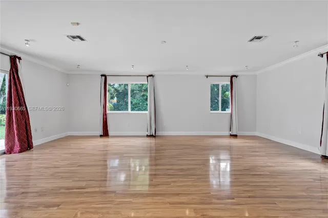 a spacious bathroom with a tub sink and mirror