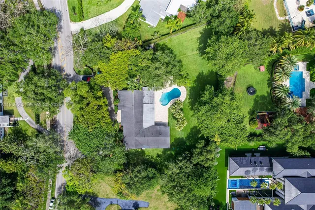 a backyard of a house with barbeque oven