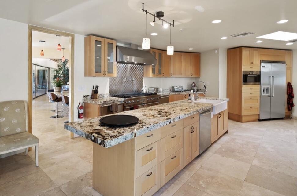 71111 La Paz Road Rancho Mirage, CA 92270 - Photo 15 of 102 a large kitchen with stainless steel appliances granite countertop a stove and a refrigerator