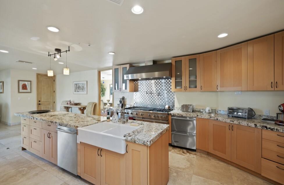 71111 La Paz Road Rancho Mirage, CA 92270 - Photo 16 of 102 a kitchen with a sink stove and cabinets