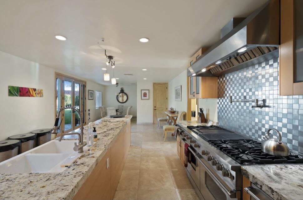 71111 La Paz Road Rancho Mirage, CA 92270 - Photo 17 of 102 a large kitchen with stainless steel appliances granite countertop a lot of counter space and a sink