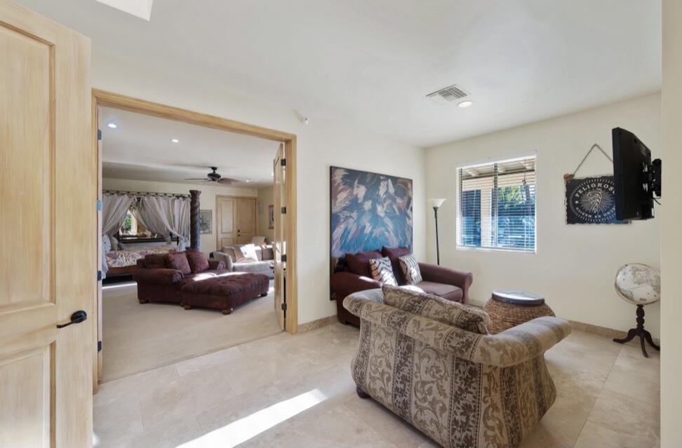 71111 La Paz Road Rancho Mirage, CA 92270 - Photo 20 of 102 a living room with furniture and a window