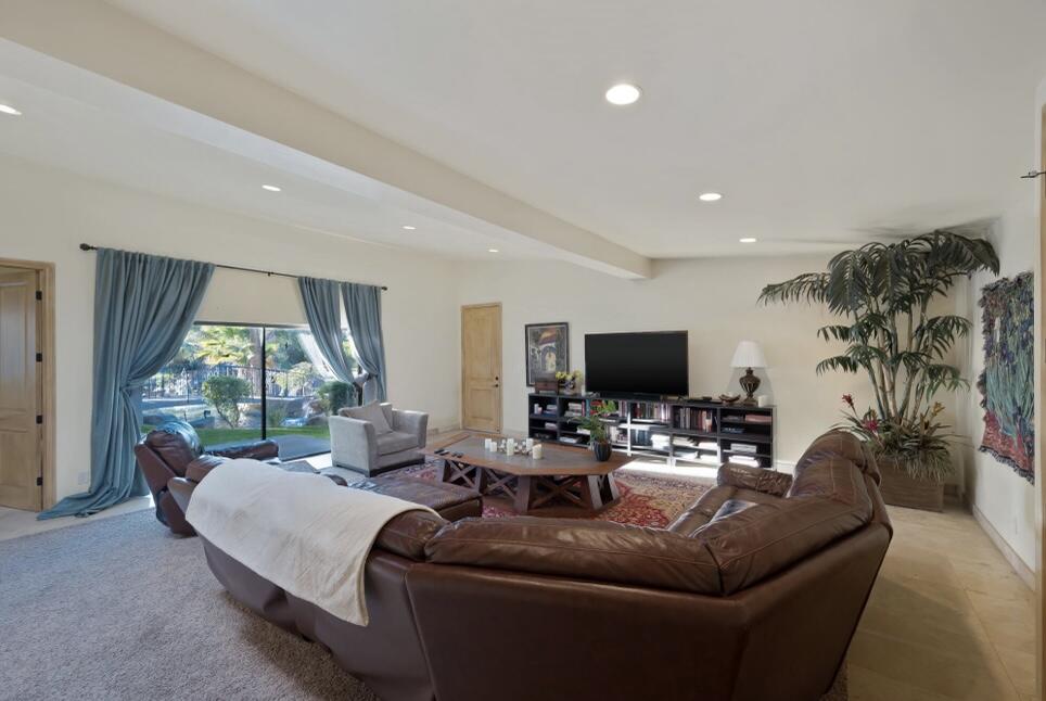 71111 La Paz Road Rancho Mirage, CA 92270 - Photo 25 of 102 a living room with furniture and a flat screen tv