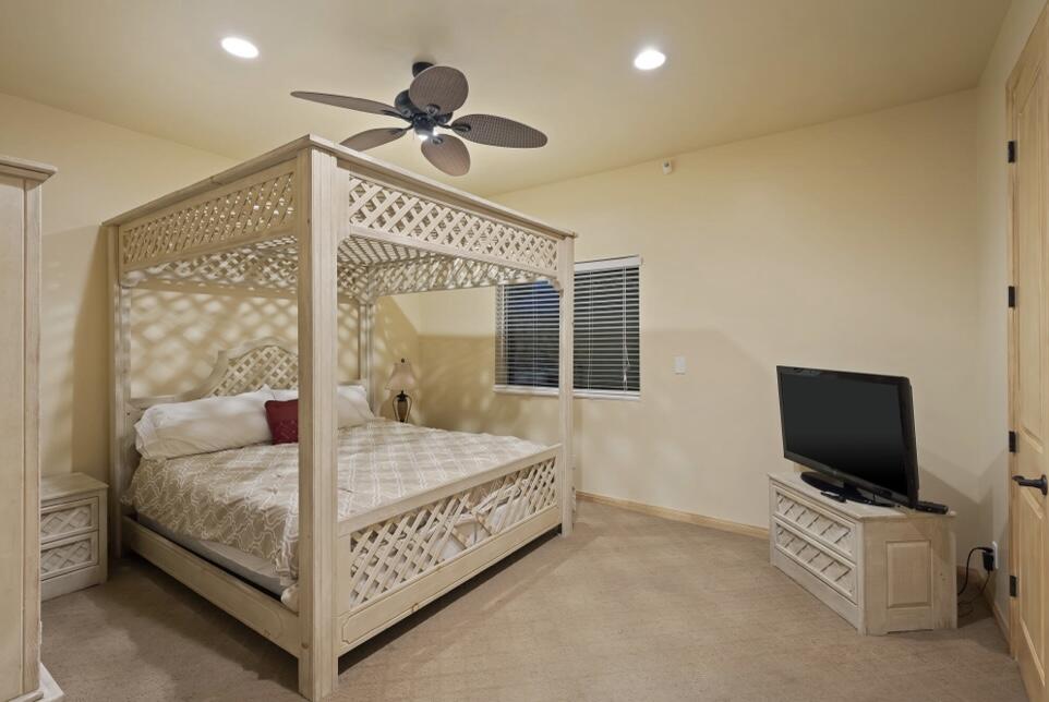 71111 La Paz Road Rancho Mirage, CA 92270 - Photo 30 of 102 a bedroom with a bed and a flat screen tv