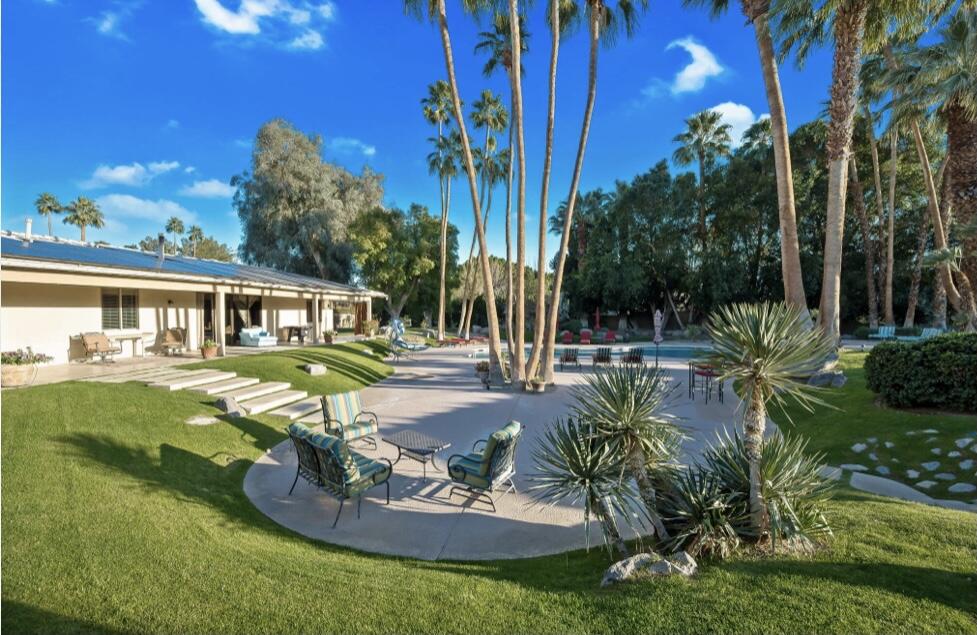 71111 La Paz Road Rancho Mirage, CA 92270 - Photo 41 of 102 a view of a house with backyard swimming pool and sitting area