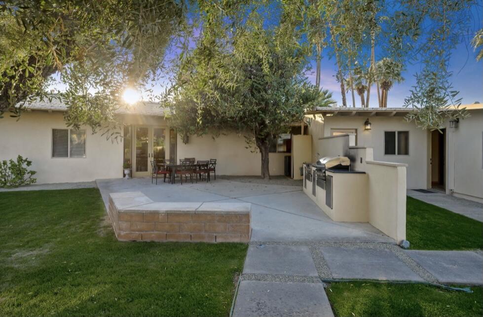 71111 La Paz Road Rancho Mirage, CA 92270 - Photo 60 of 102 a view of a house with patio and a garden