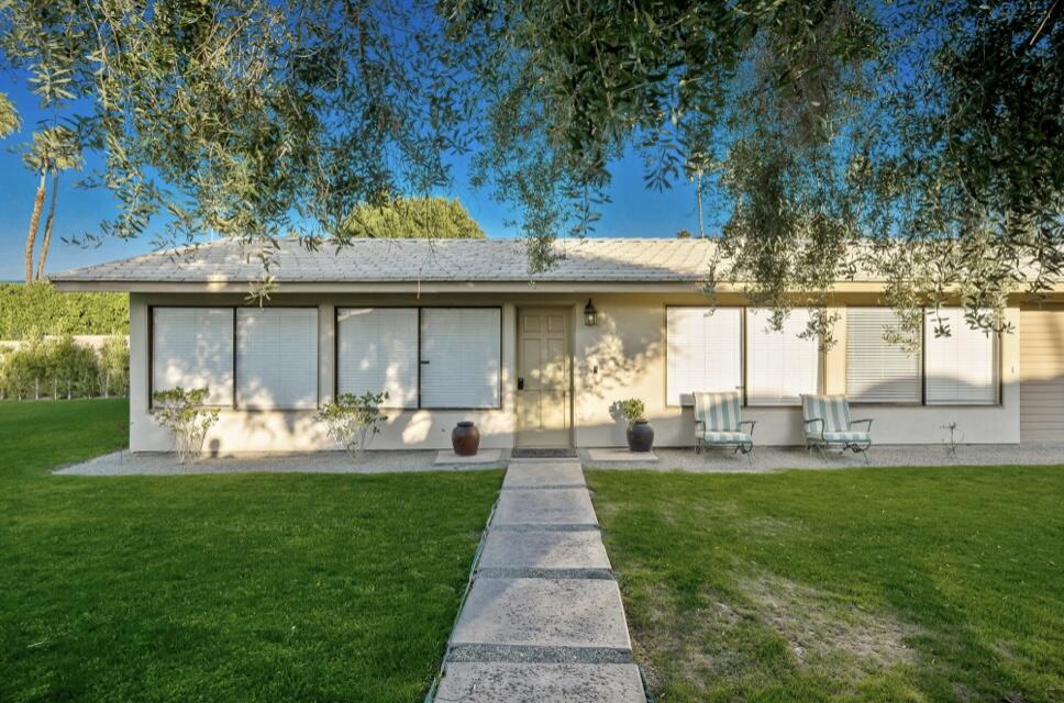71111 La Paz Road Rancho Mirage, CA 92270 - Photo 61 of 102 a front view of a house with garden and porch