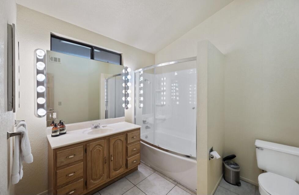 71111 La Paz Road Rancho Mirage, CA 92270 - Photo 66 of 102 a bathroom with a double vanity sink toilet mirror and shower