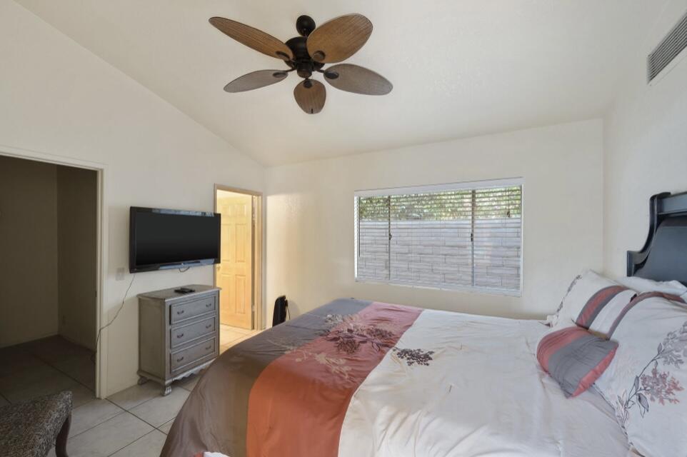 71111 La Paz Road Rancho Mirage, CA 92270 - Photo 67 of 102 a bedroom with a bed and a flat screen tv
