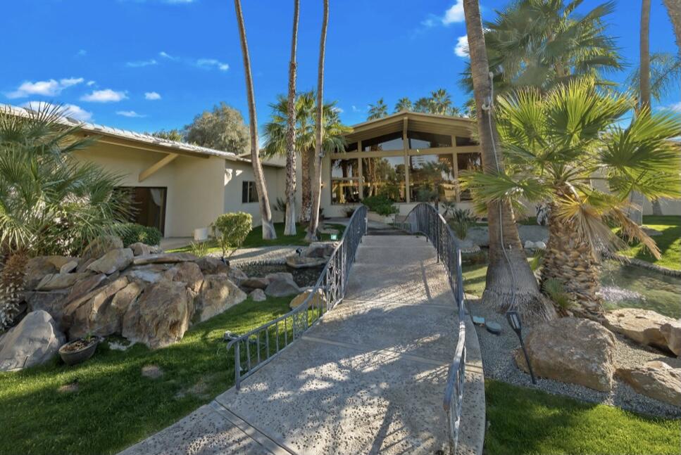 71111 La Paz Road Rancho Mirage, CA 92270 - Photo 74 of 102 a view of a patio with table and chairs under an umbrella