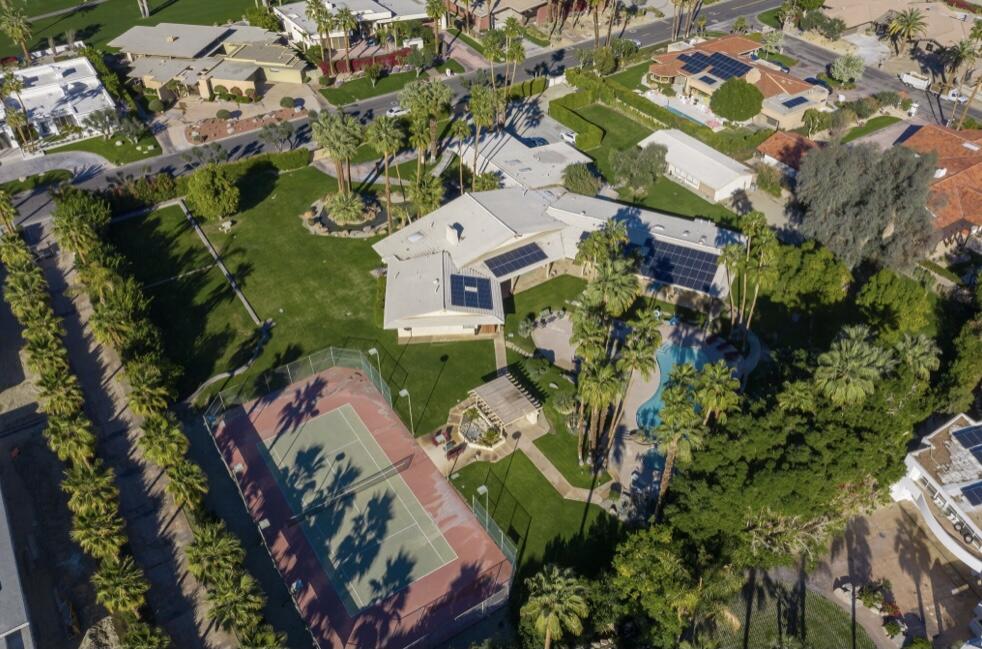 71111 La Paz Road Rancho Mirage, CA 92270 - Photo 80 of 102 an aerial view of a house with a yard and garden