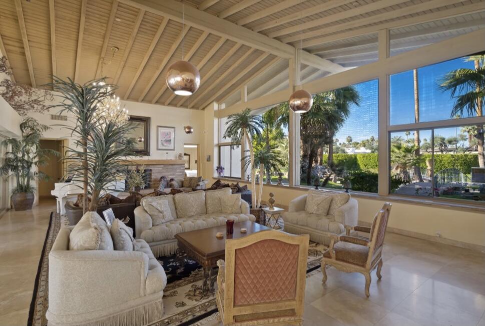 71111 La Paz Road Rancho Mirage, CA 92270 - Photo 8 of 102 a living room with furniture a lamp and a potted plant