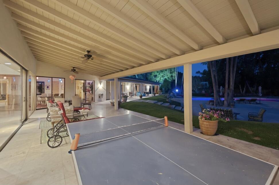 71111 La Paz Road Rancho Mirage, CA 92270 - Photo 94 of 102 a view of a patio with table and chairs potted plants with wooden floor