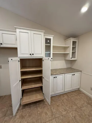a kitchen with a sink and cabinets