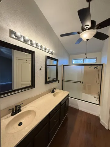 a view of a room with wooden floor
