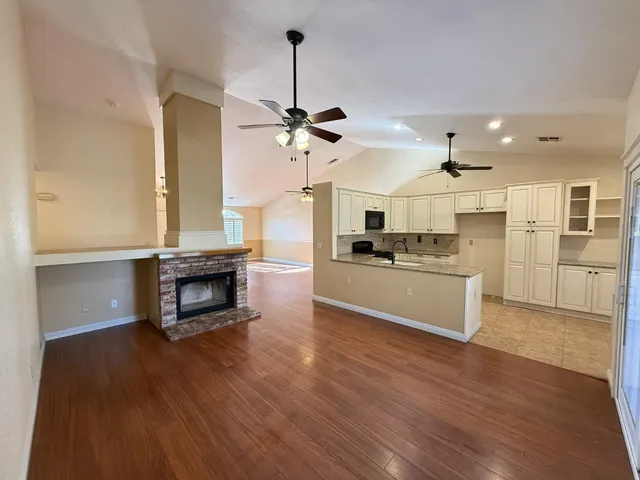 a view of kitchen with cabinets and wooden floor