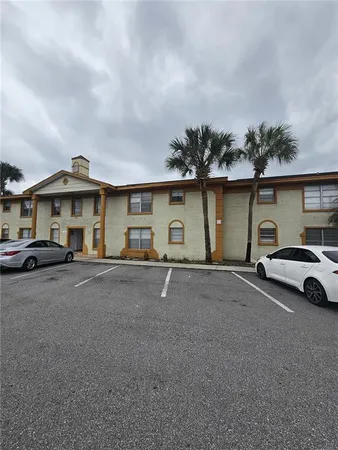 a couple of cars parked in front of a house