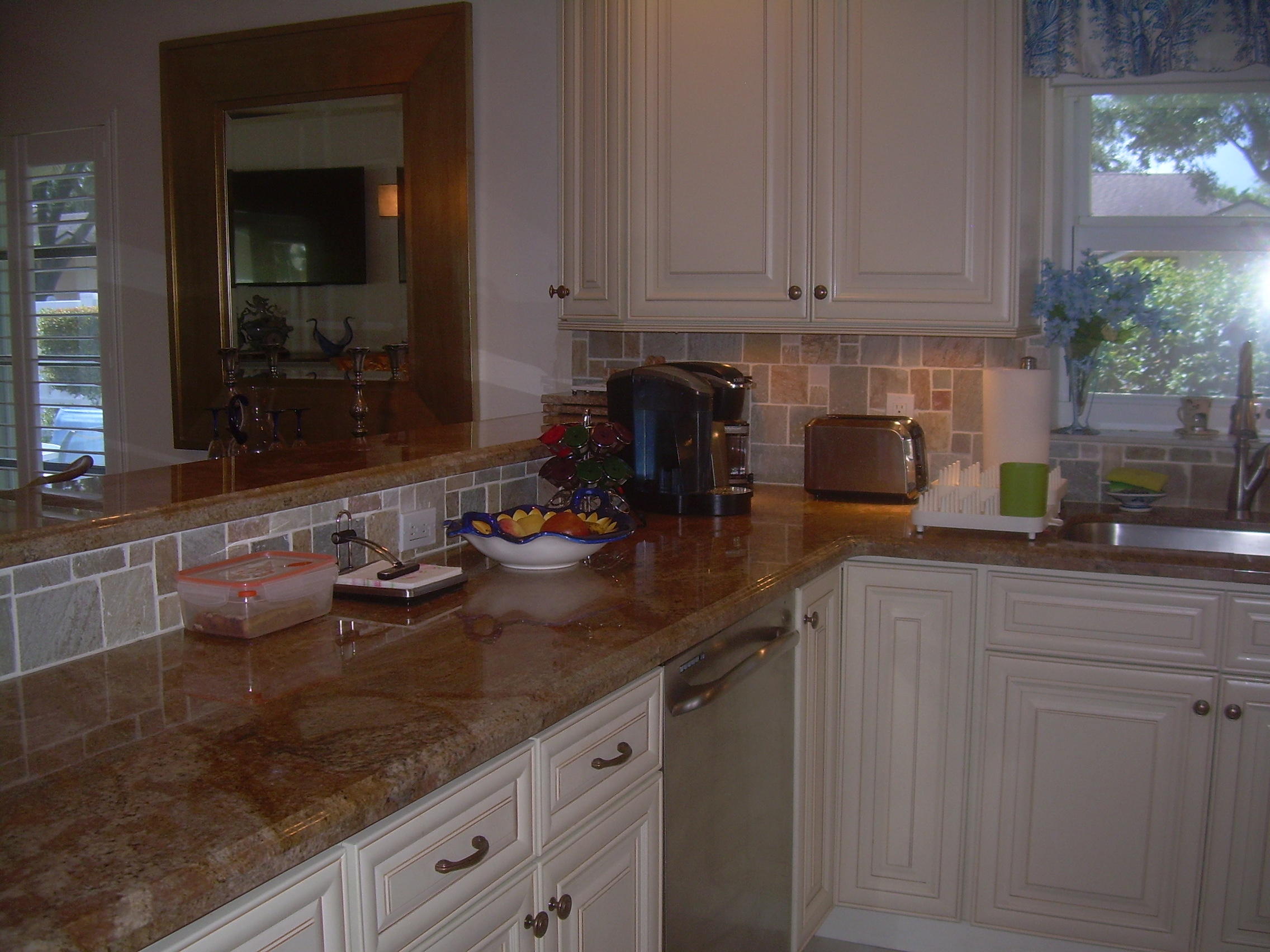 8700 Jasmine Way, Unit B Boca Raton, FL 33496 - Photo 7 of 32 a kitchen with sink and cabinets