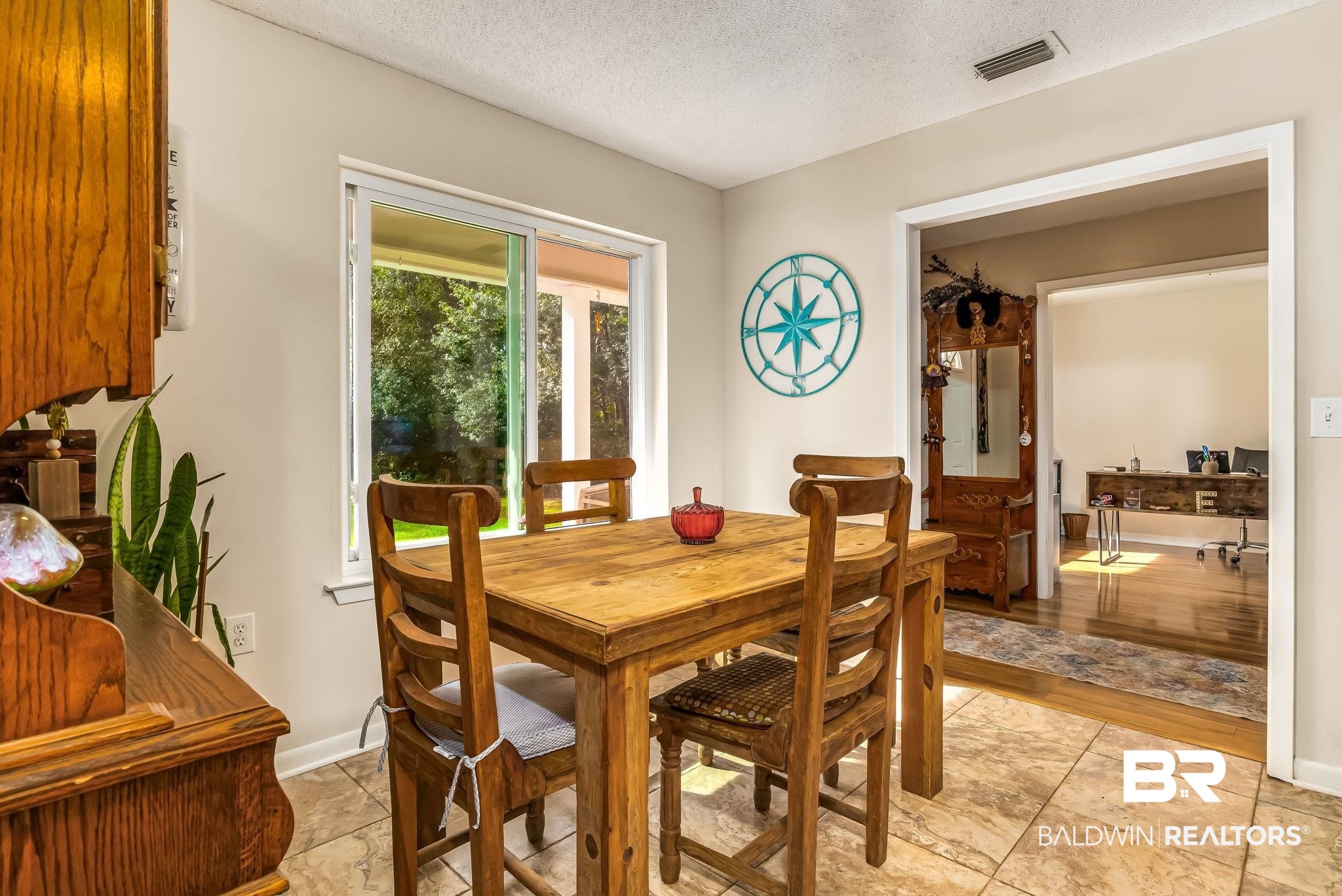 12199 Bay Road West Foley, AL 36535 - Photo 16 of 62 Dining room featuring a textured ceiling and baseboards