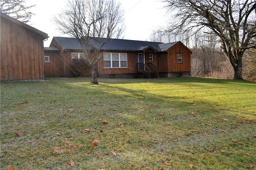 1220 State Rte 28 And 66 Templeton, PA 16259 - Photo 23 of 24 a front view of a house with a garden and deck